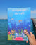 australian sea life activity book being held up