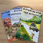 Three australian activity books on a wooden surface with Australian-themed content.