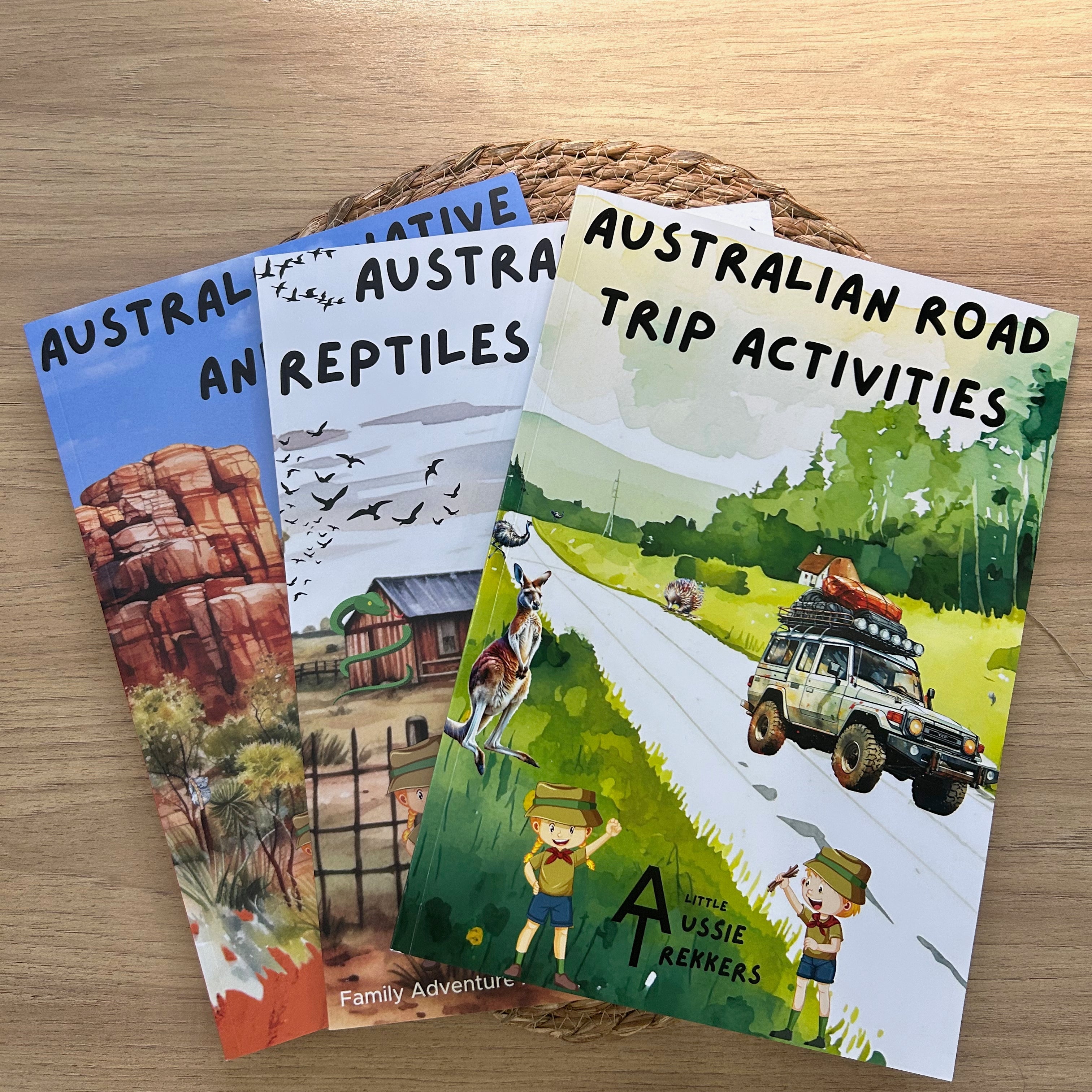 Three australian activity books on a wooden surface with Australian-themed content.