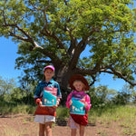 two kids holding a australian kids journal titled the kimberley