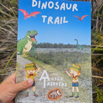 Dinsosaur travel journal held up