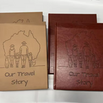Two leather-bound Australian Travel Journals titled 'Our Travel Story' with a family and dog illustration debossed into journal