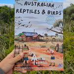 Australian reptiles and birds activity book held up