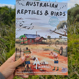 Australian reptiles and birds activity book held up